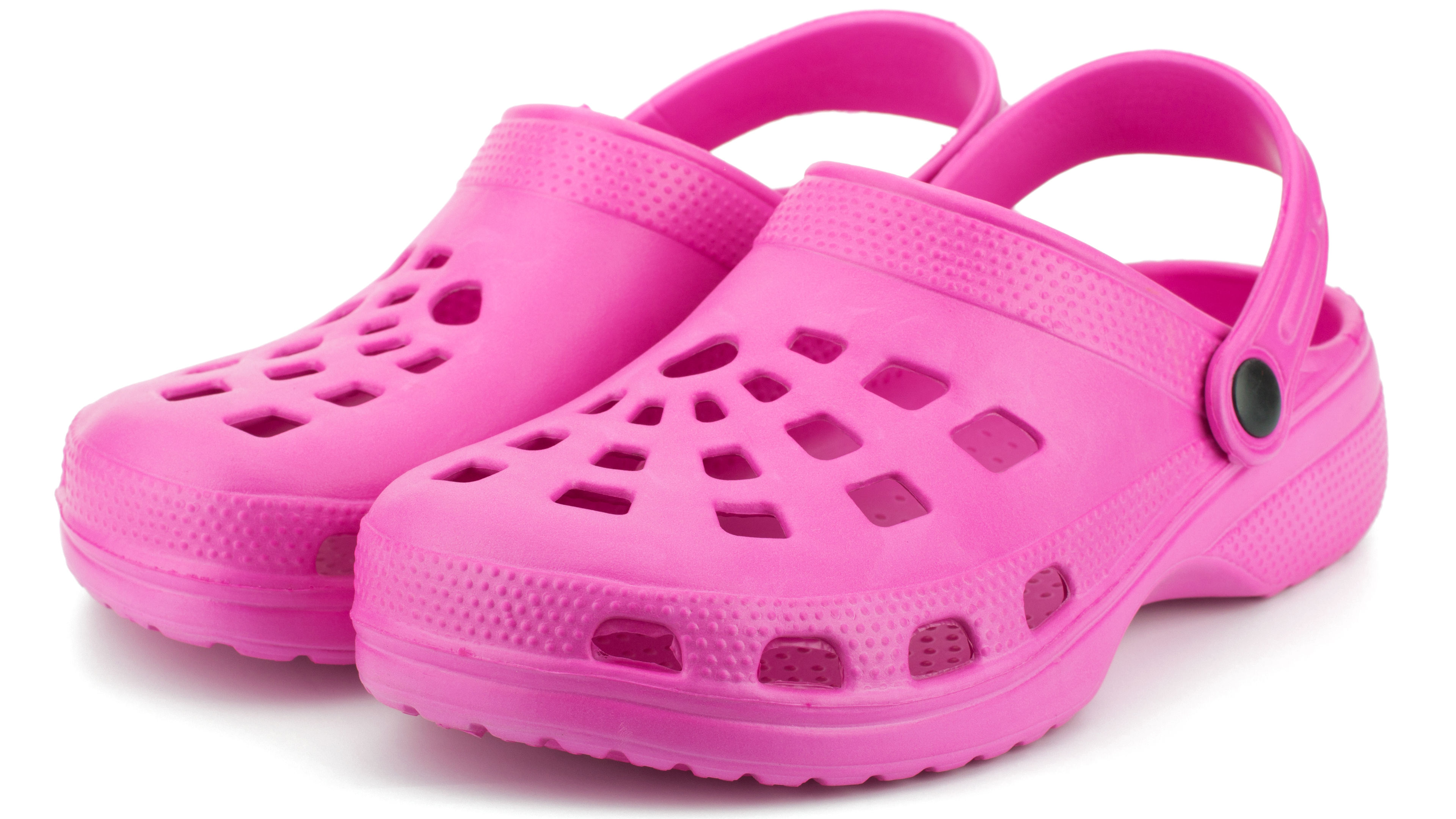 A pink color Crocs footwear on a white background.