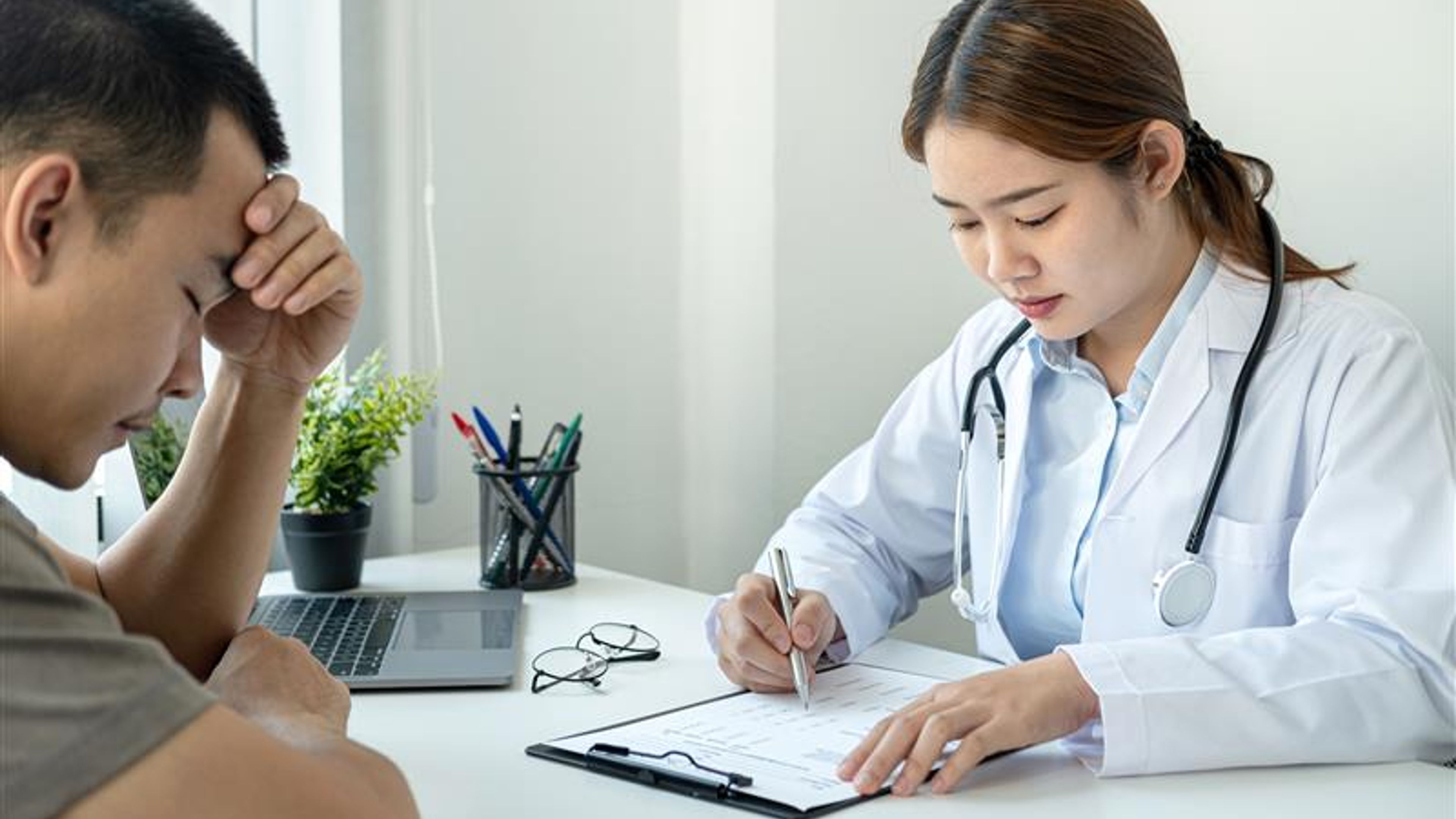 A doctor with a stressed man 