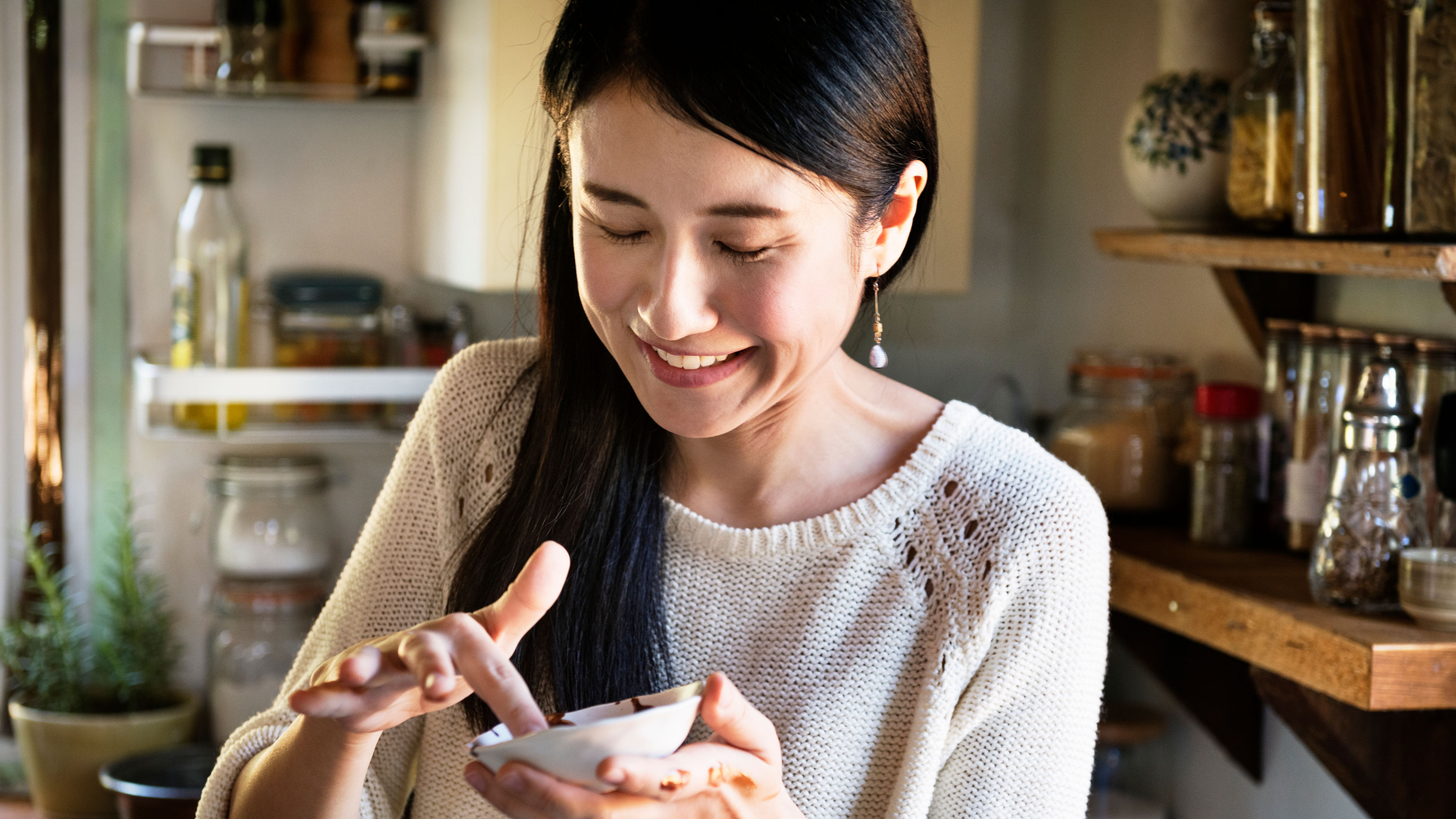 A woman tasting food