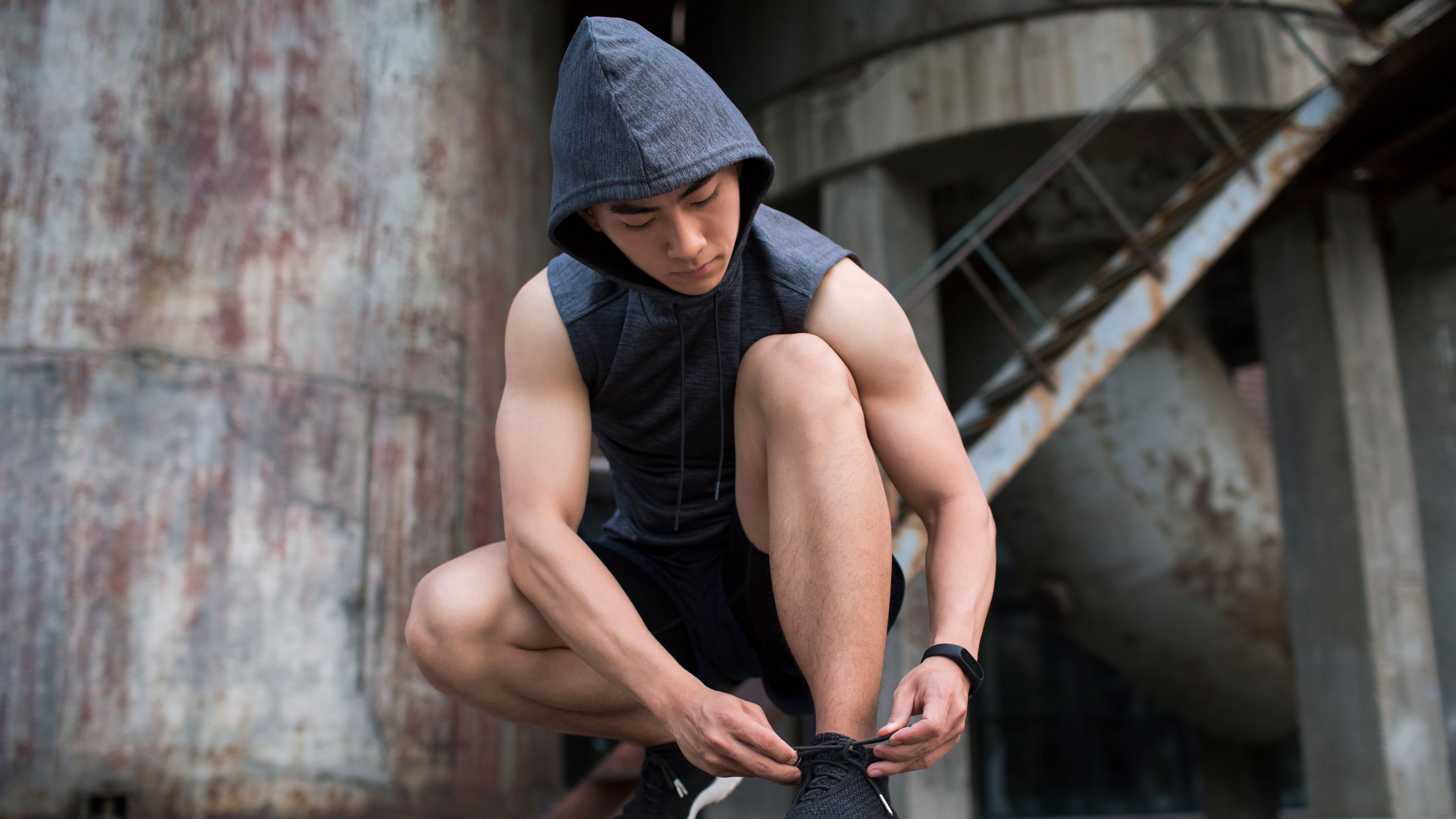 Athletic Man Tying Shoelaces 