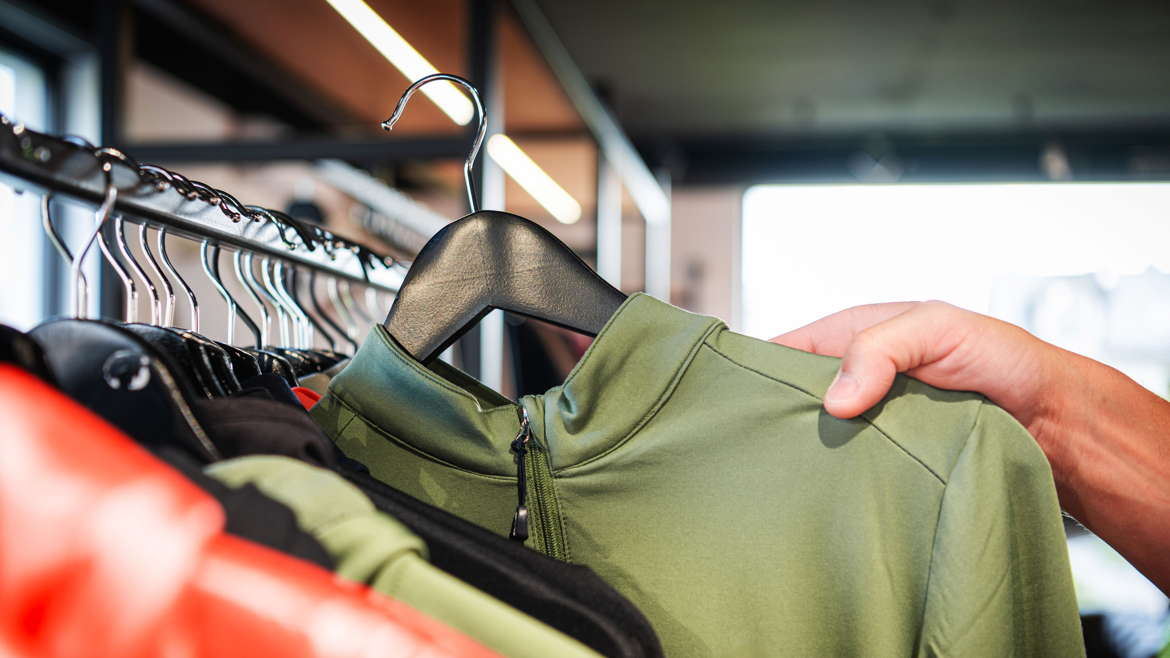 Man choosing athletic top