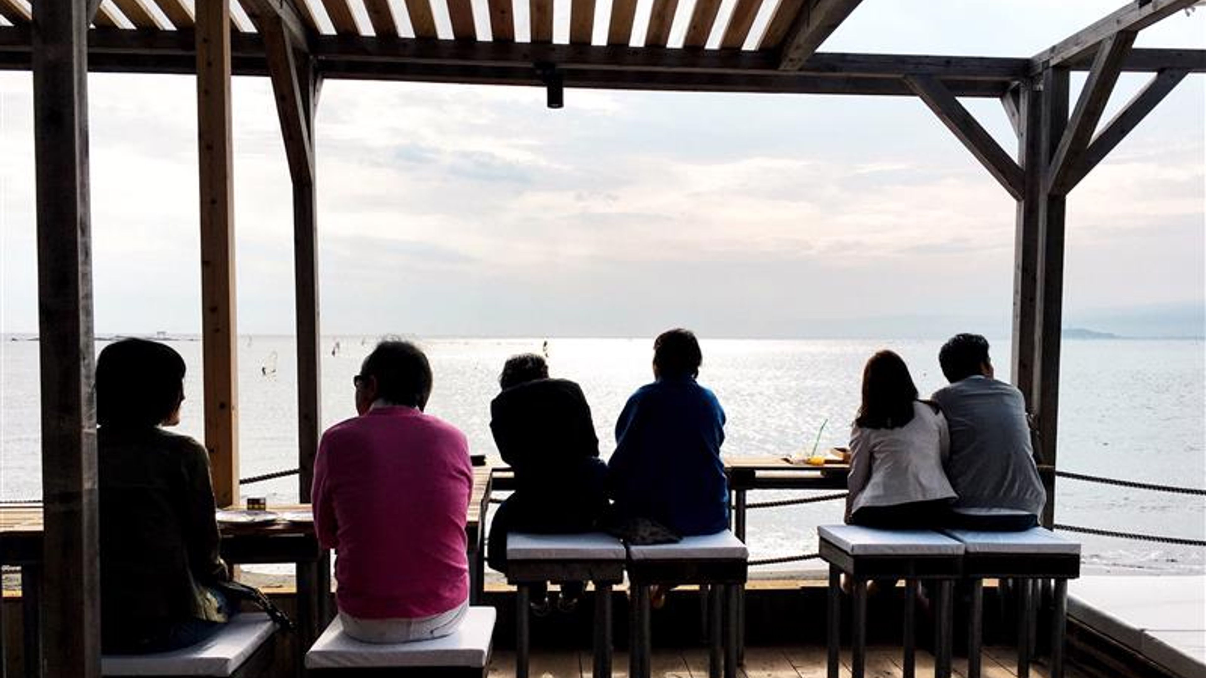 Some people looking at the sea.