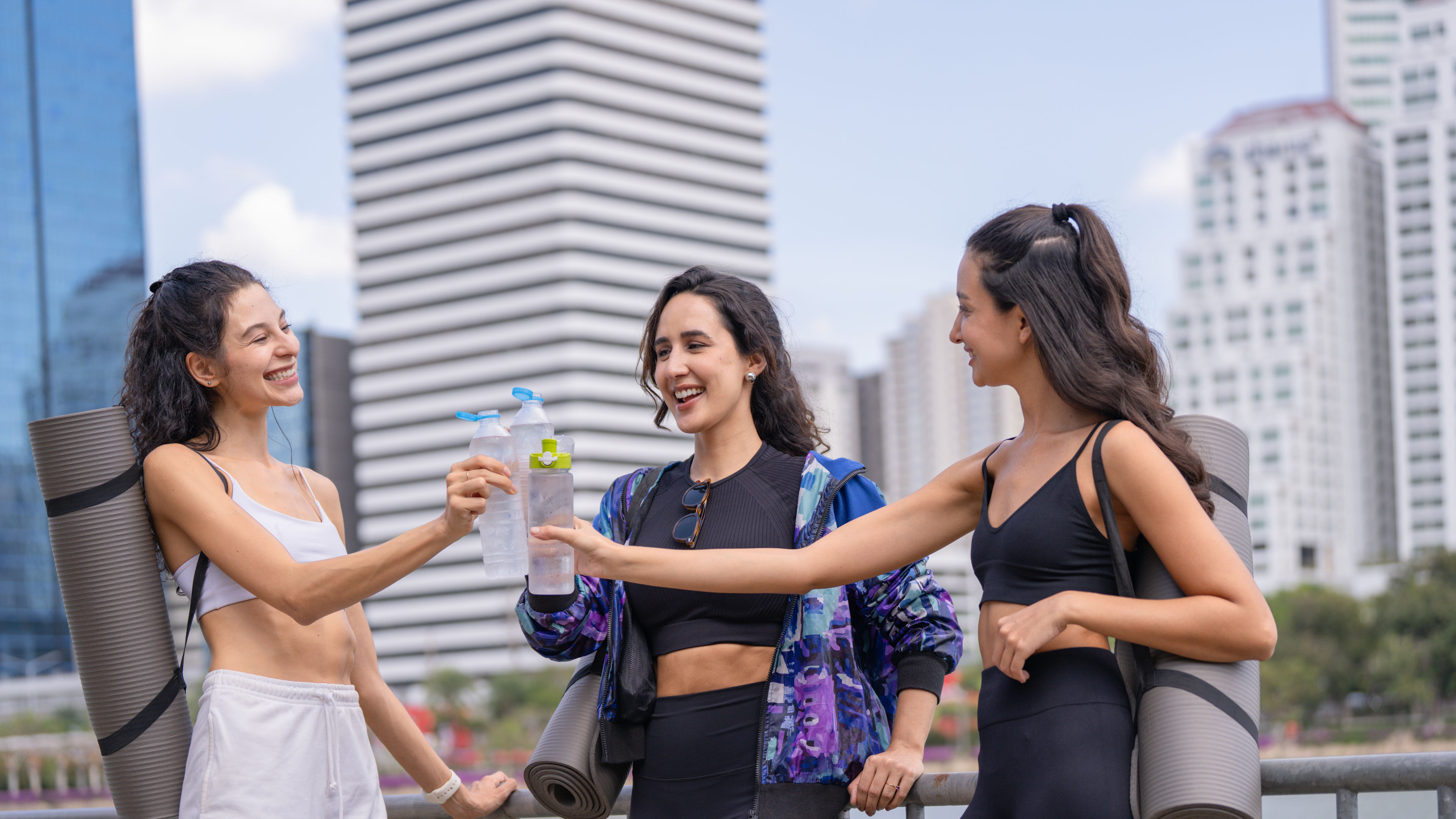 Three Active Young Women Toasting 
