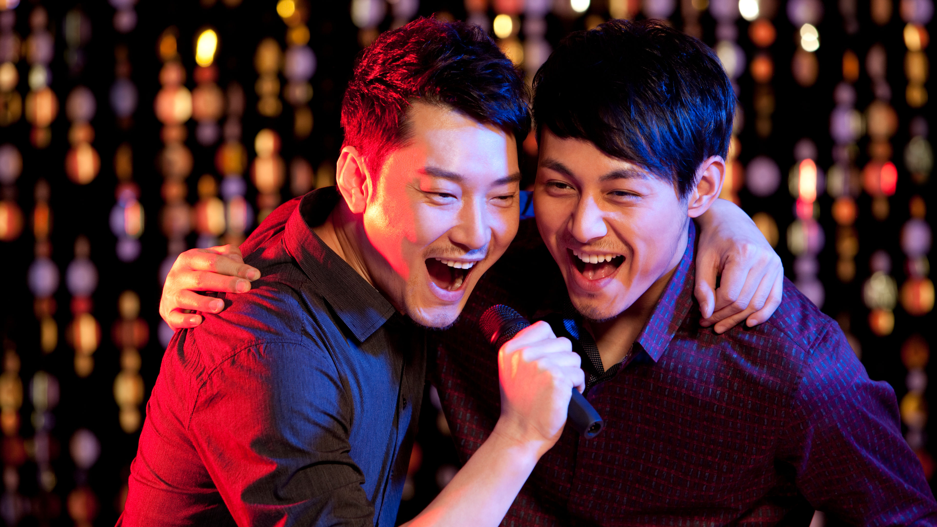 Two friends singing.  