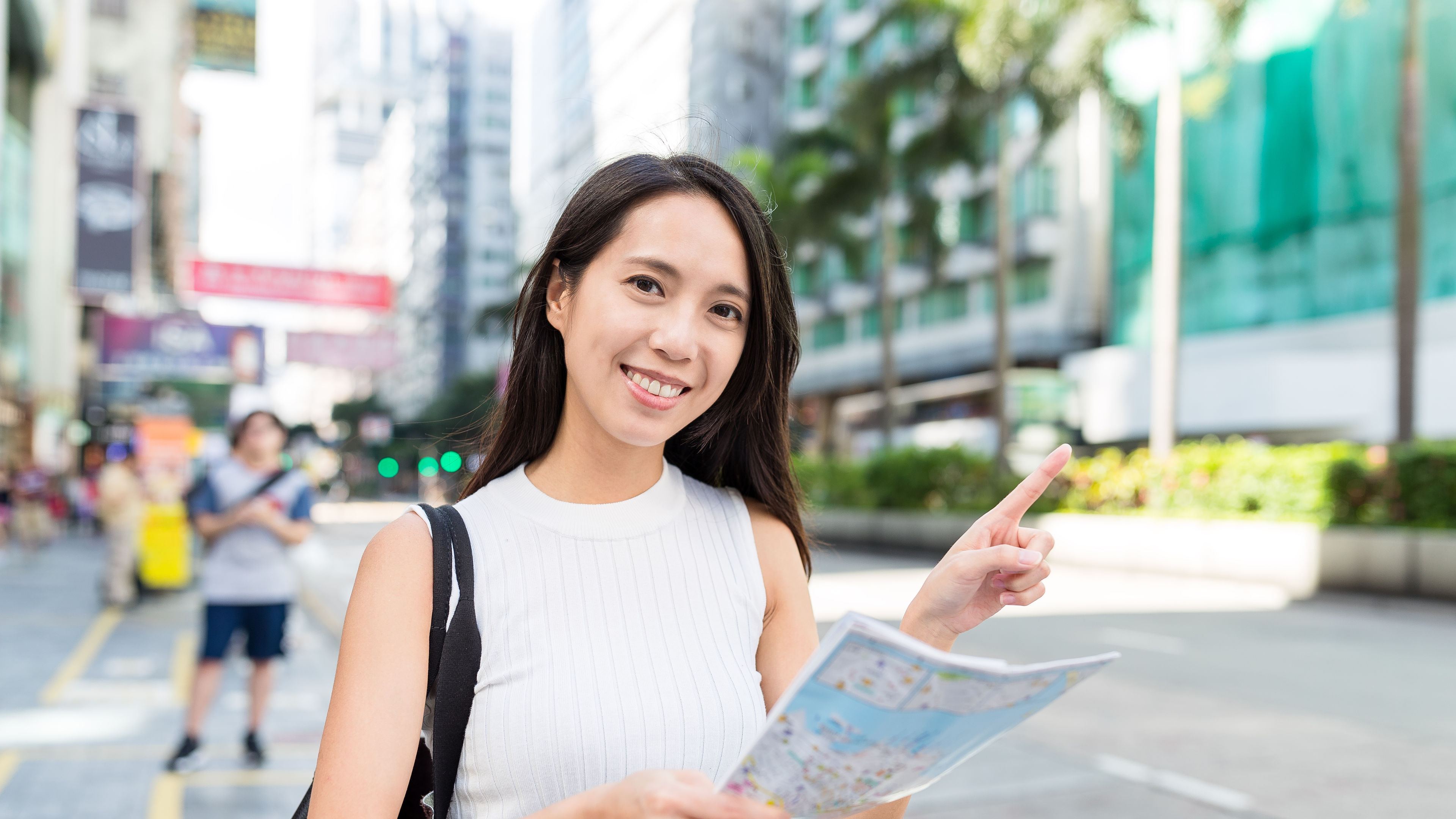 Woman using city map. 