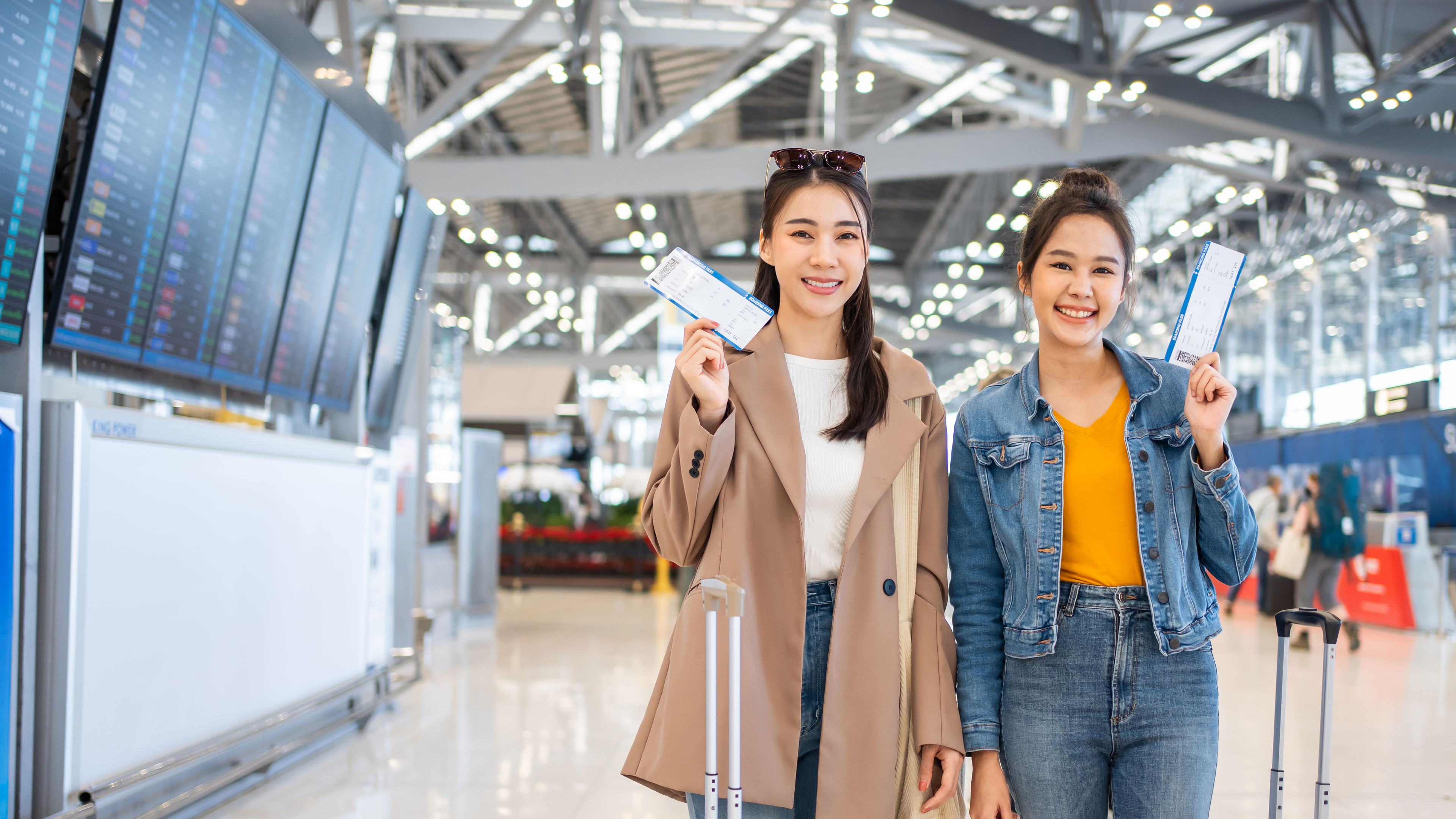 Women holding their boarding pass