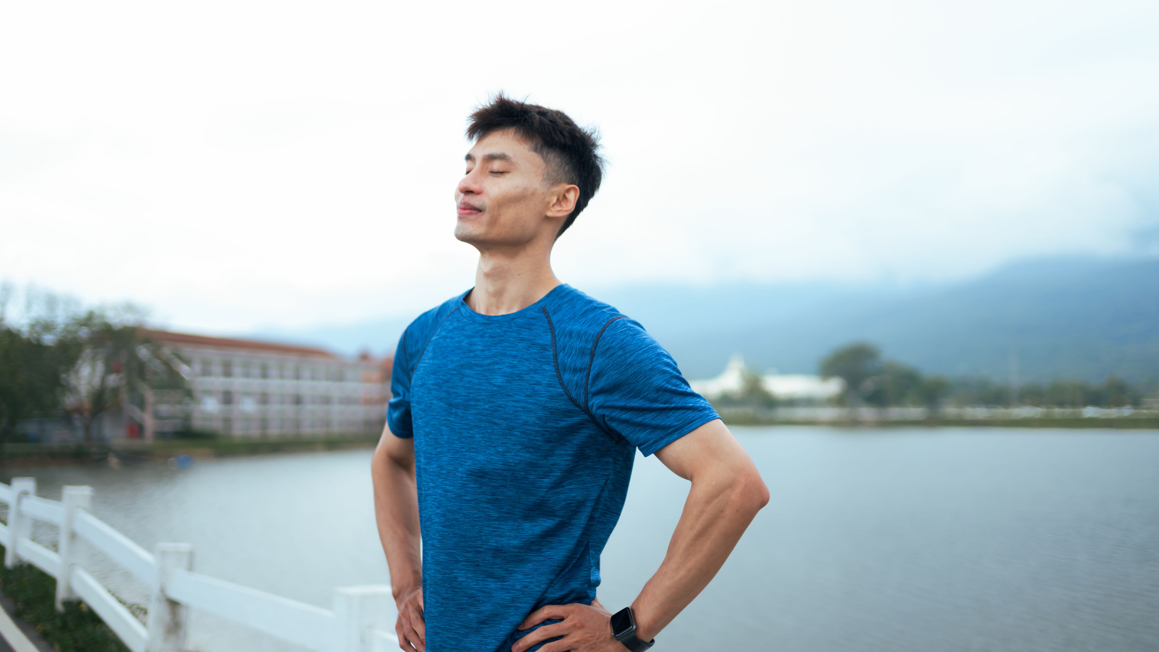 Young Man in Blue Athletic Shirt