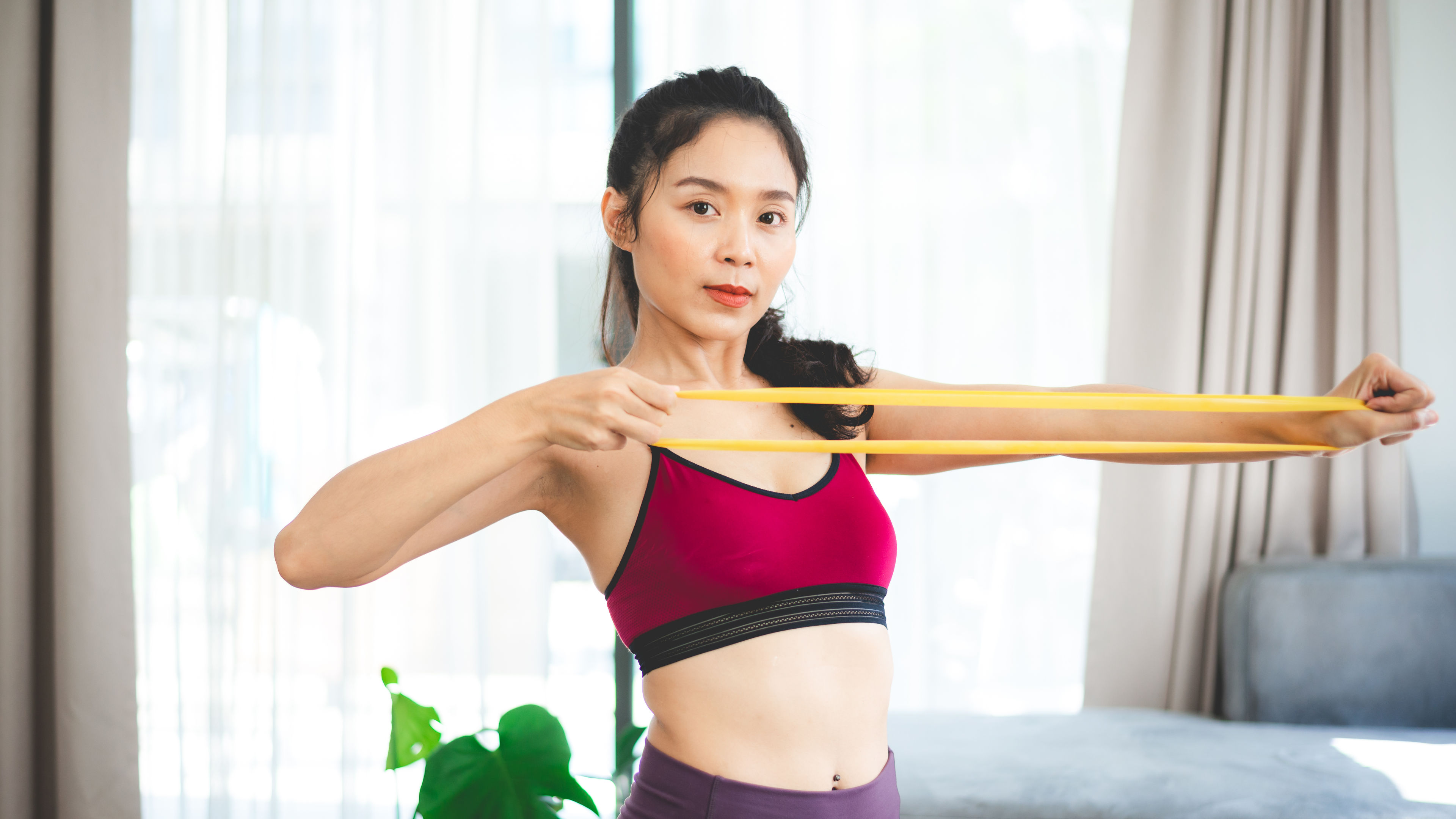 Young woman doing exercise at home